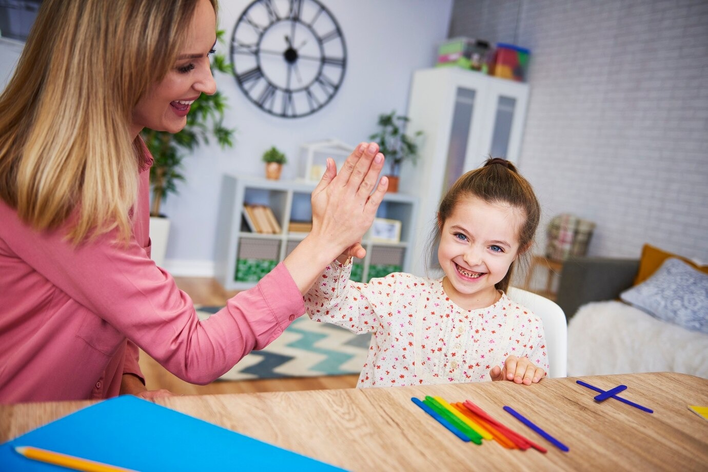young-mother-teaching-child-at-home-during-therapy